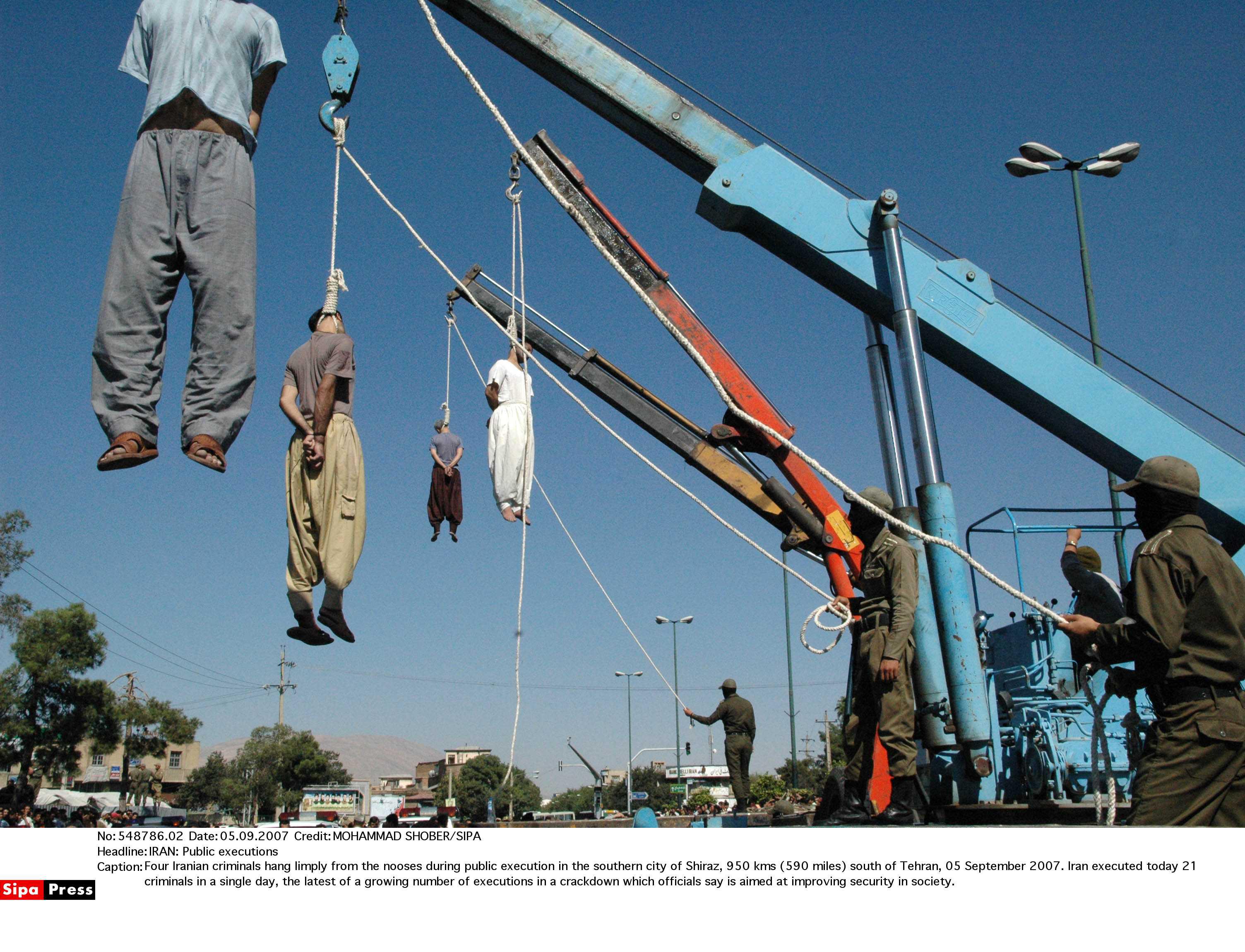 Four Iranian criminals hang limply from the nooses during public execution in the southern city of Shiraz, 950 kms (590 miles) south of Tehran, 05 September 2007. Iran executed today 21 criminals in a single day, the latest of a growing number of executions in a crackdown which officials say is aimed at improving security in society.