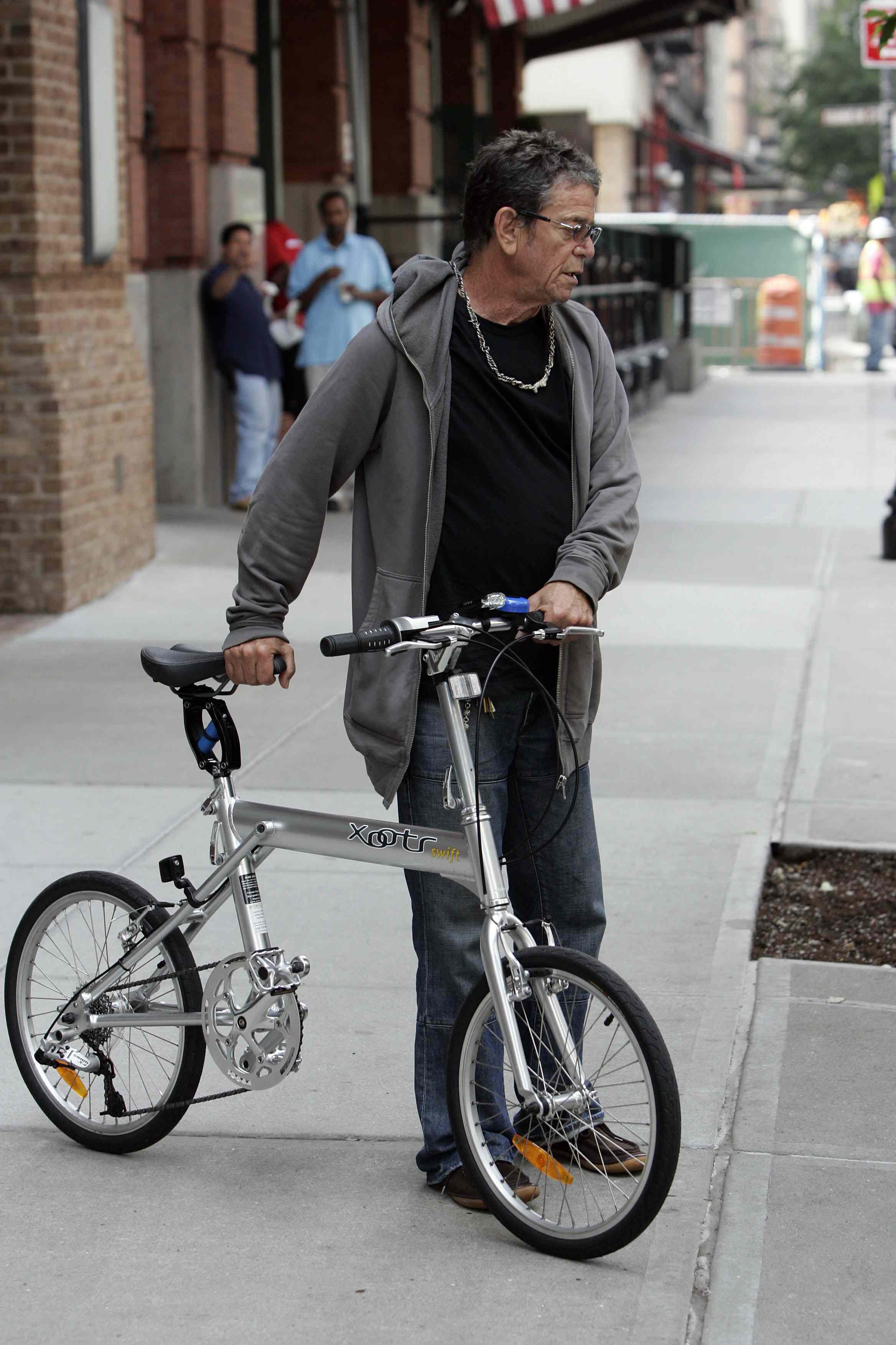 June 28 2011, New York City Wrinkly rock legend Lou Reed goes green with his bicycle in downtown Manhattan on June 28 2011 in New York City Please byline: CURTIS MEANS - ACEPIX/INFOPHOTO