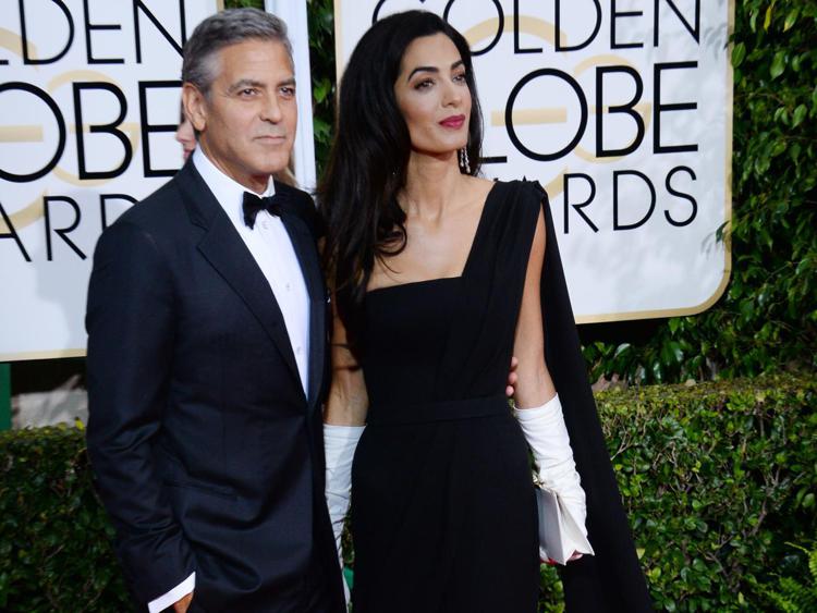 George Clooney e la moglie Amal (Foto Infophoto)