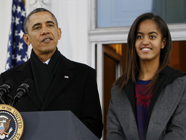 Barack Obama con la figlia Malia (Xinhua)