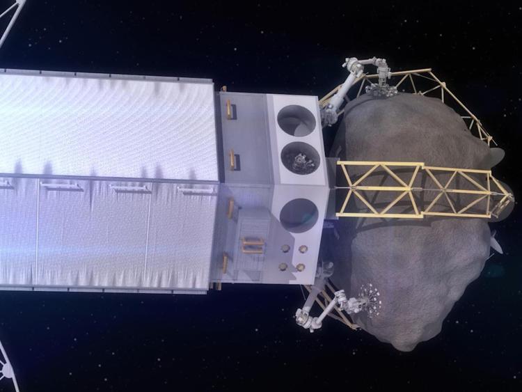 Ricostruzione grafica della Nasa mostra un veicolo spaziale che cattura un masso da un asteroide (Xinhua)