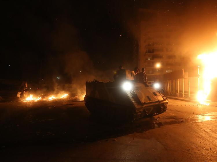 Immagini degli scontri di sabato a Beirut AFP PHOTO /str - AFP