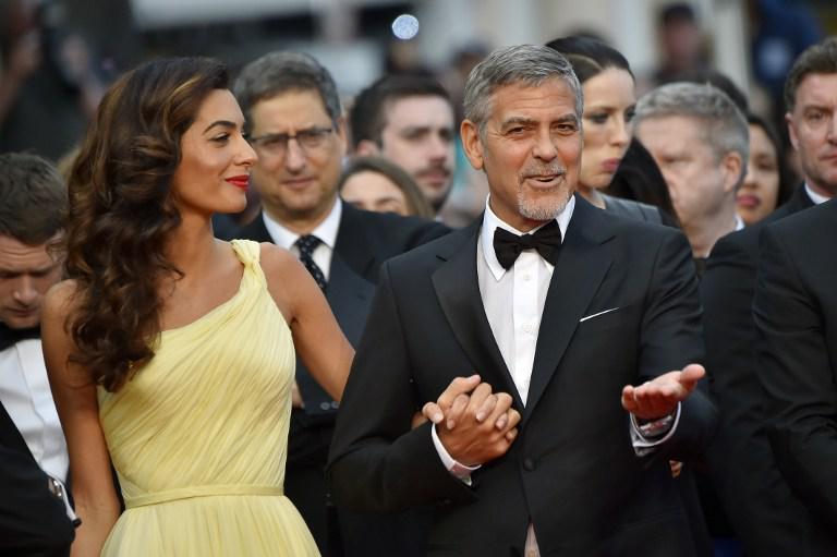 George Clooney e Amal AFP PHOTO / LOIC VENANCE