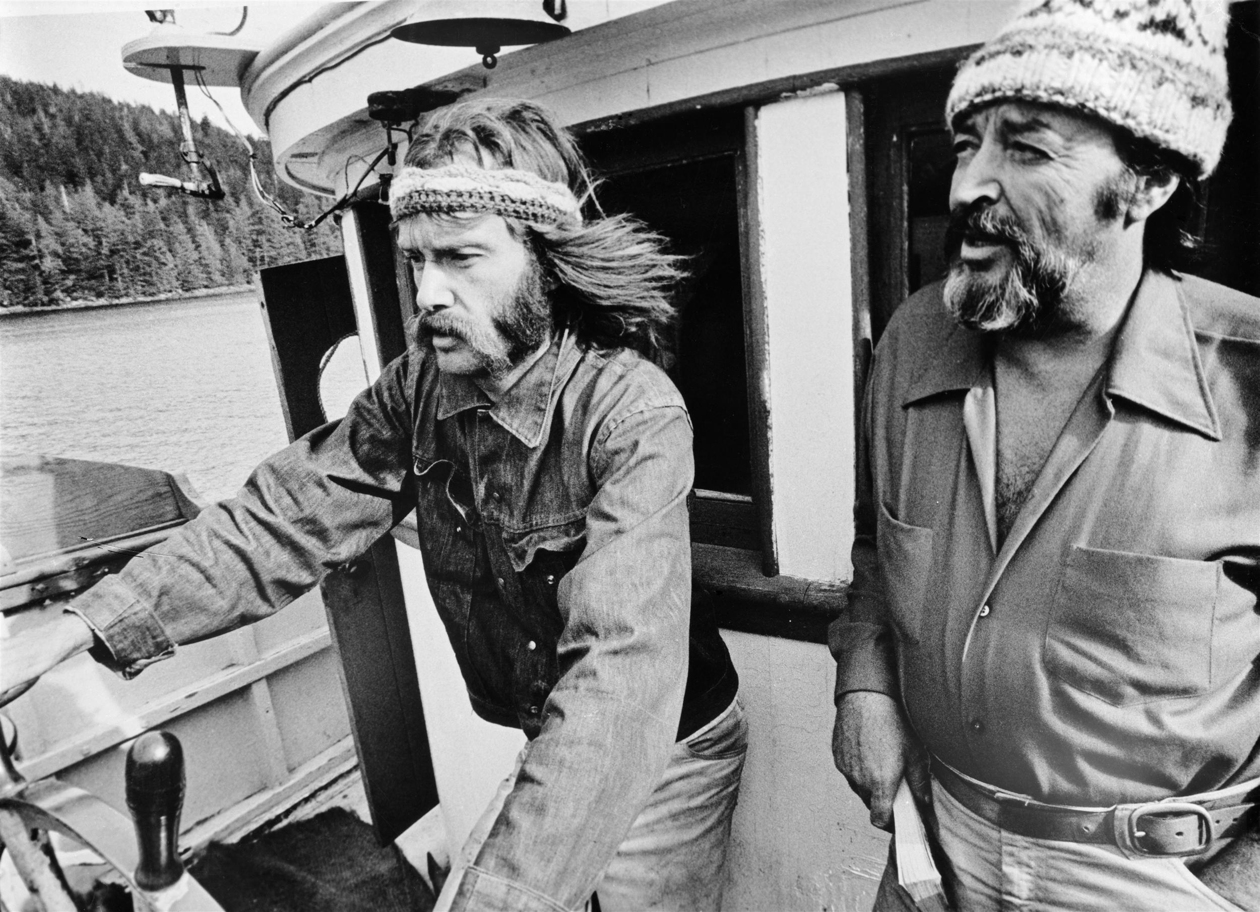 Bob Hunter on left at the helm of the Phyllis Cormack together with Ben Metcalfe. En route to Amchitka. (Greenpeace Witness book page 94) (The Greenpeace story book page 12 similar).