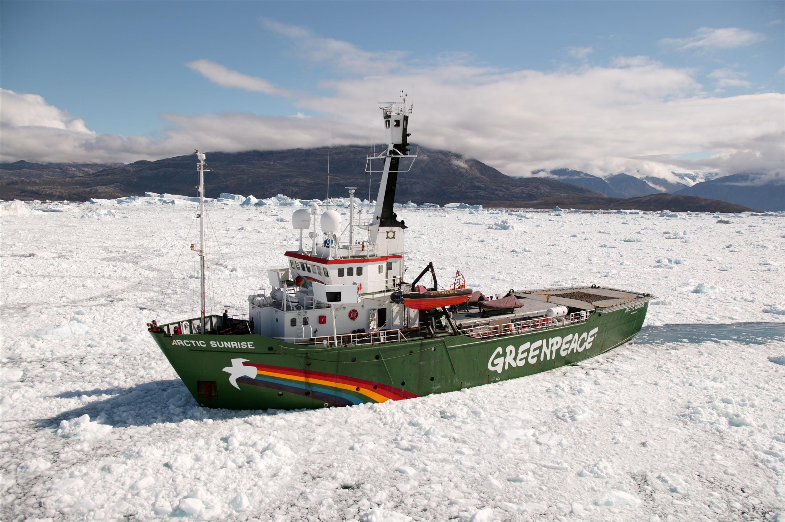 The Greenpeace ship MY Arctic Sunrise making her way through ice in the fjord of Scoresbysund as part of her tour of Greenland to document and support scientific work on the impacts and effects of Climate Change