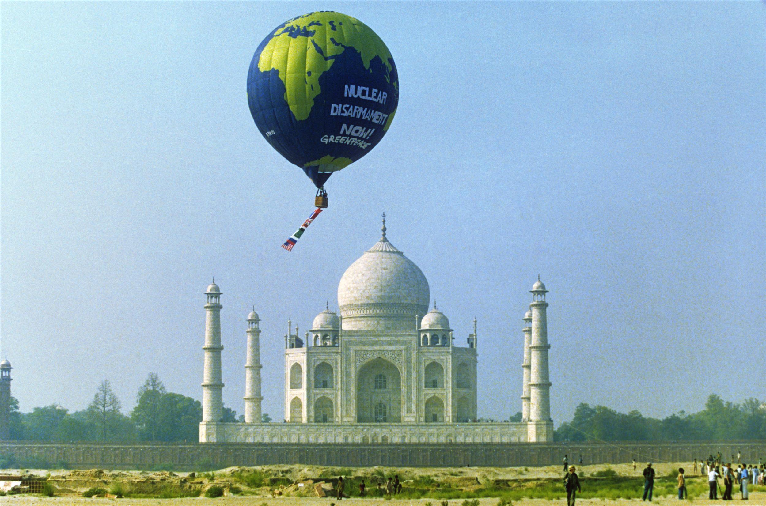 The Greenpeace hot air balloon with the slogan ‘Nuclear Disarmament Now!’ flies above the famous Taj Mahal in a protest against nuclear testing in India.