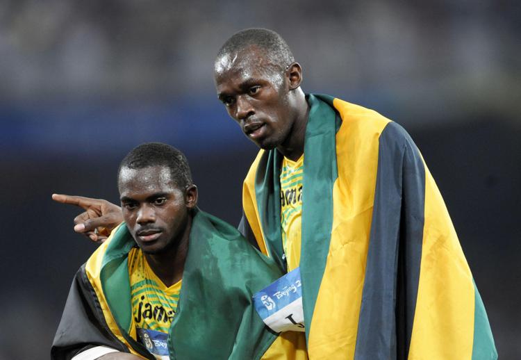 Gli atleti giamaicani Nesta Carter e Usain Bolt a Pechino 2008 - AFP
