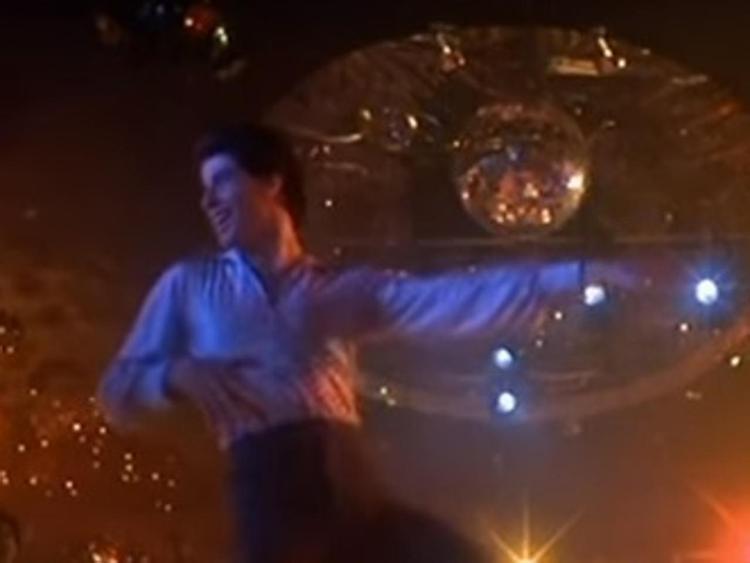 John Travolta nei panni di Tony Manero ne 'La febbre del sabato sera' (Fermo immagine)