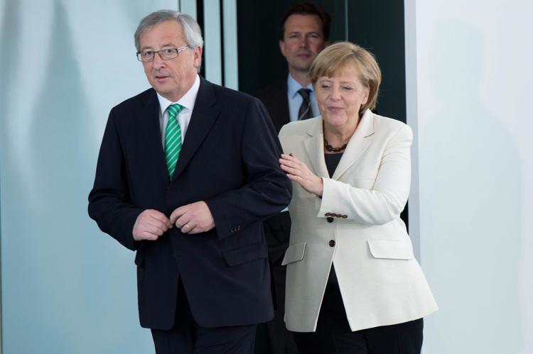 Jean-Claude Juncker e Angela Merkel (Foto Infophoto) - INFOPHOTO