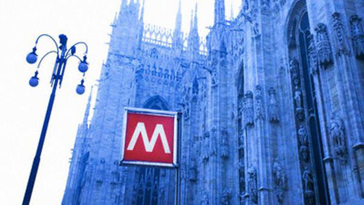 Cathedral and Subway Sign in Milan Italy --- Image by © Ocean/Corbis - © Ocean/Corbis