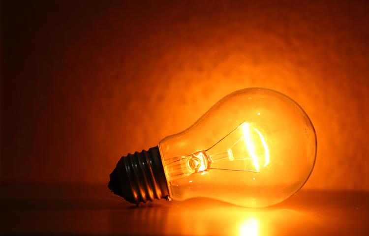 Close up of electric tungsten bulb illuminating