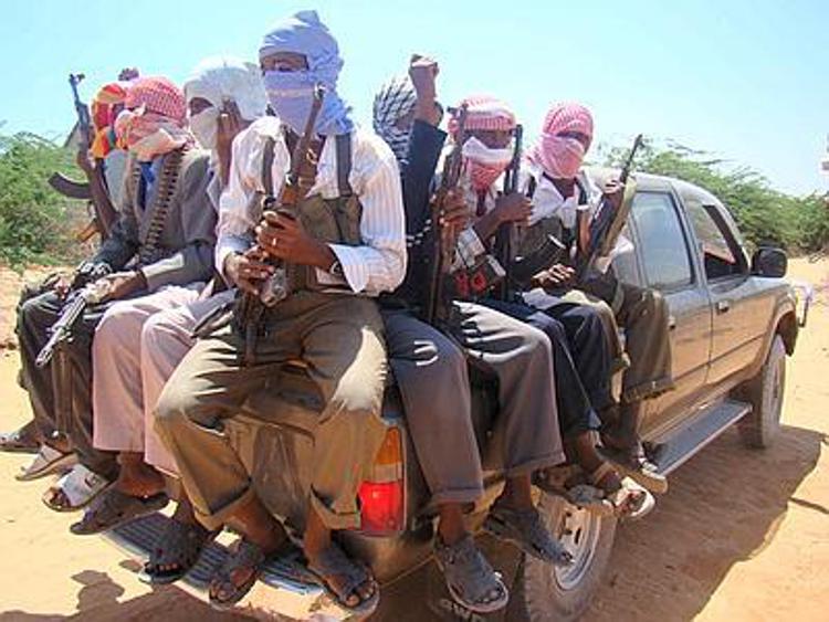 (090202) -- MOGADISHU, Feb. 2, 2009 (Xinhua) -- Somali Islamist militants of a coalition of four insurgent groups parade on the outskirts of the Somali capital Mogadishu, Feb. 2, 2009. The four rebel groups, the Dr. Omar Iman faction of the Union of Islamic Courts (UIC), Faruk Anole, Raskamboni, and the Islamic Front of Somalia, announced opposition to the newly-elected President of Somalia Shiekh Sharif Shiekh Ahmed in Mogadishu on Monday. (Xinhua/Abdurrahman Warsameh) (zy)