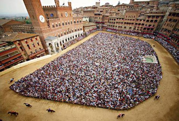 Sienese crush ... a crowd in Piazza del Campo awaits the action.