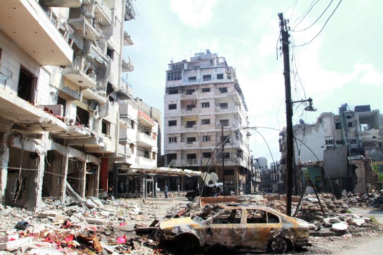 Imagini di devastazione a Homs (Infophoto)