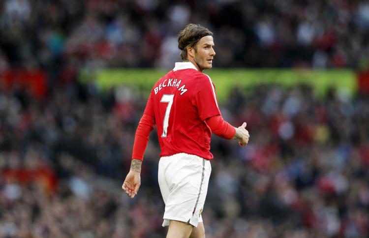 David Beckham quando giocava nel Manchester United con la maglia numero 7 (Foto Infophoto)