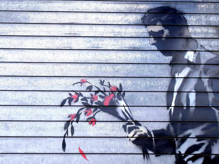 L'opera dell'artista inglese Banksy a New York (Infophoto)