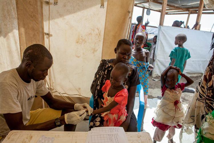 Malaria screening at an MSF field clinic near the registration site for new arrivals in Bentiu POC. Photo by Brendan Bannon. September 2015. Bentiu, South Sudan - Brendan Bannon