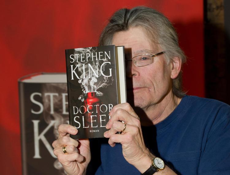 US author Stephen King holds his new book in Munich, Germany, 19 November 2013. King unveiled his new book 