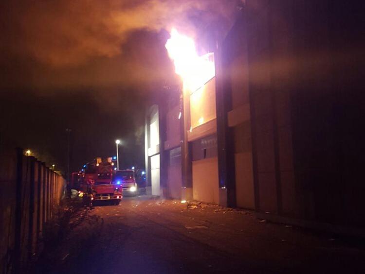 Migrants protest deadly blaze at disused factory