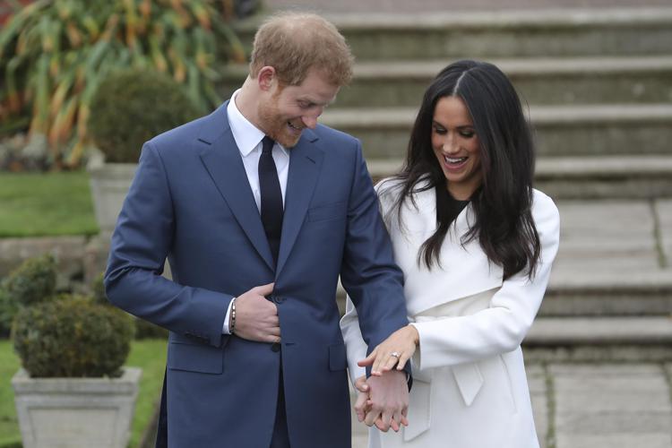 Il principe Harry e  la fidanzata Meghan Markle (AFP PHOTO)