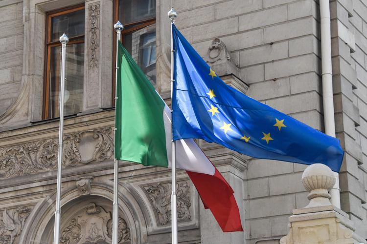 The flags of Italy and European Union flying at the Italian embassy in Moscow. - Photo: AFP