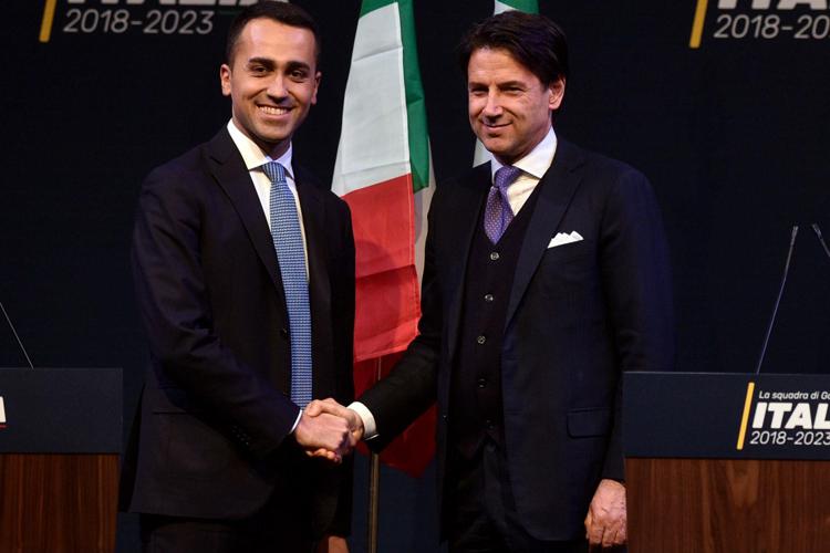 Five-Star leader Luigi Di Maio (L) shakes hands with Giuseppe Conte (R)