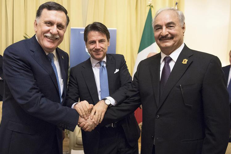 Fayez al-Serraj (left) Giuseppe Conte (centre) and Khalifa Haftar (right) after talks in Palermo  in November 2018