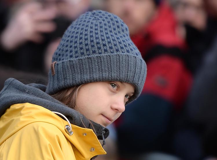 Swedish climate activist Greta Thunberg arrives to takes part at a Friday for Future strike on climate emergency, in Turin, on December 13, 2019. - Greta Thunberg, the teenager who became the voice of a generation facing the climate change emergency, was named Time magazine's 2019 Person of the Year. Unknown to the world when she launched a solo strike against global warming in mid-2018, the 16-year-old has since inspired millions in a worldwide movement that saw her tipped as a Nobel laureate. (Photo by Filippo MONTEFORTE / AFP) - AFP
