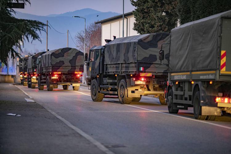 In one of the most haunting images of Italy's COVID-19 epidemic, an army convoy transports Coronavirus victims' coffins in the northern city of Bergamo in late March 2020  because its cemeteries and crematoriums were all full.Photo: Â©Sergio Agazzi 