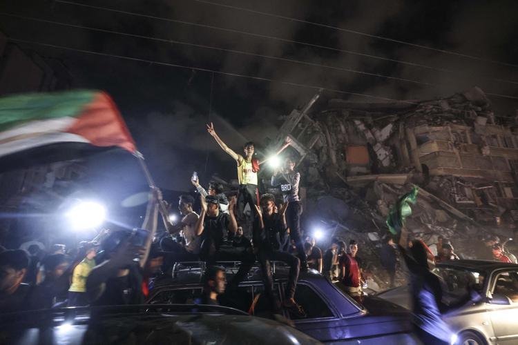 Palestinians celebrate the ceasefire brokered by Egypt between Israel and the the ruling Hamas Islamic movement in Gaza City on May 21, 2021Photo: AFP