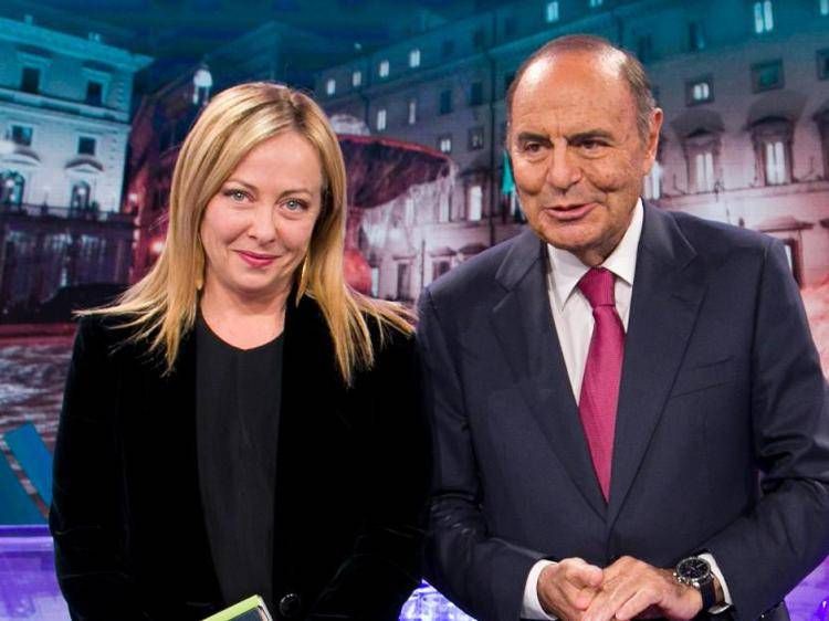 Italy's premier Giorgia Meloni (L) with  'Porta a Porta' host Bruno Vespa (R) 