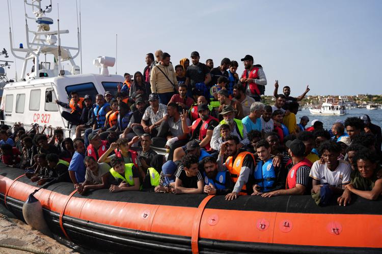 Migrants arrive on Italy's tiny, southernmost island of Lampedusa