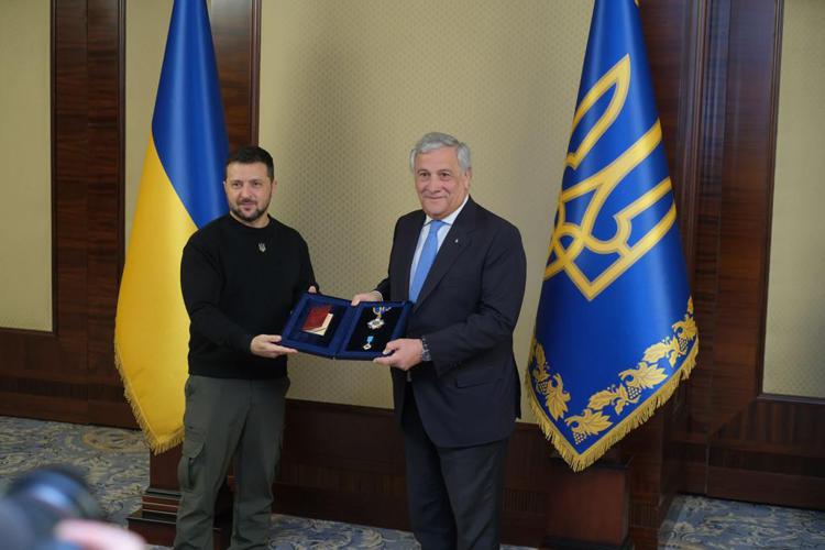 Ukraine's president Volodymyr Zelensky (L) and Italy's foreign minister Antonio Tajani  (R)