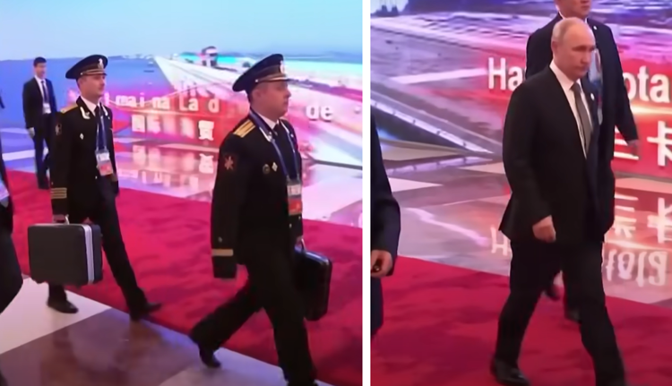 Gli ufficiali di Marina con la valigetta nucleare a poca distanza dal presidente russo Putin in Cina nelle riprese che circolano sul web
