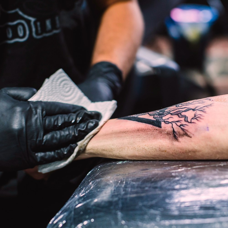 Master wipingtattoo arm