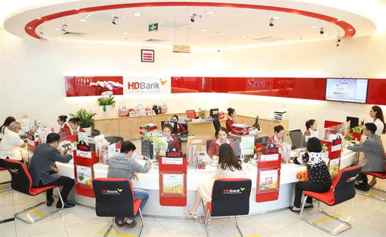 Customers conduct transactions at an HDBank branch in HCM City. Photo courtesy of HDBank