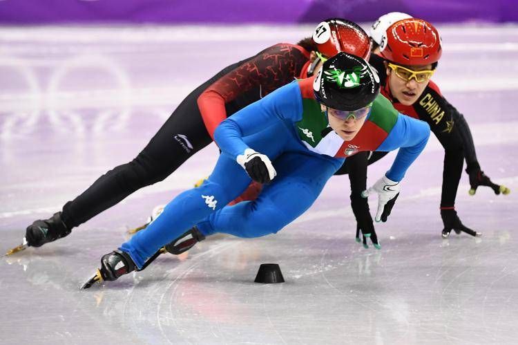 (front to back) Italy's Arianna Fontana leads Canada's Valerie Maltais, China's Li Jinyu and Japan's Hitomi Saito in the women's 1,000m short track speed skating quarter-final event during the Pyeongchang 2018 Winter Olympic Games, at the Gangneung Ice Arena in Gangneung on February 22, 2018. / AFP PHOTO / ARIS MESSINIS - AFP