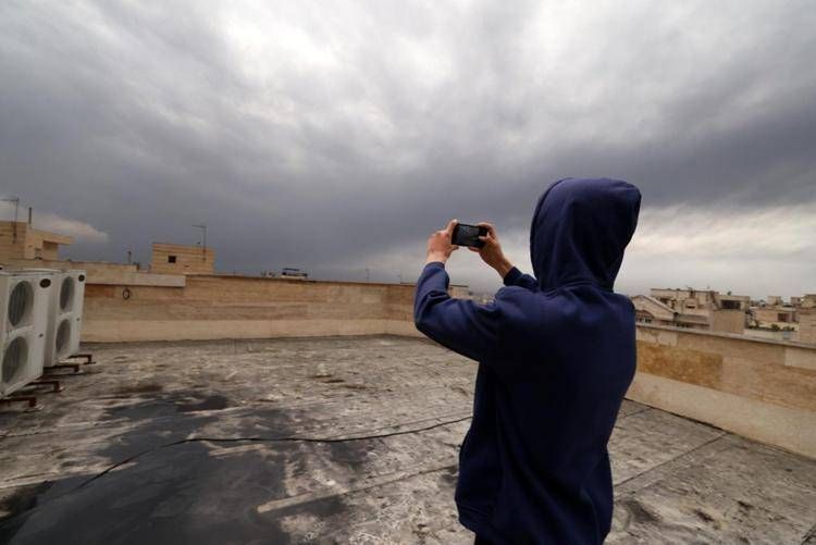 Nubi e polvere nera dal cielo di Teheran - Afp