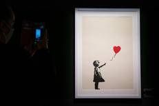 L'opera di Banksy 'Girl With Balloon' - Ipa