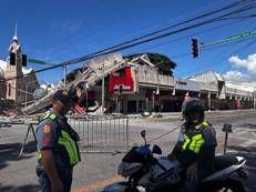 Edificio collassato a General Santos dopo il terremoto nelle Filippine - Afp