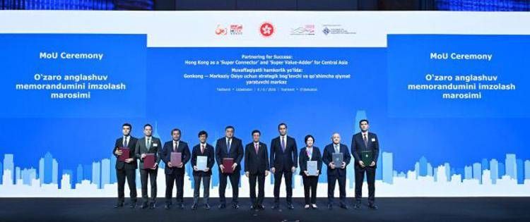 Hong Kong SAR's Chief Executive, John Lee (fifth right) and the Advisor to the President of Uzbekistan on Strategic Development, Sardor Umurzakov (fourth right) witness the exchange of memoranda of understan