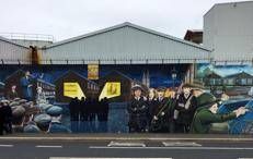 Murals commemorate Irish historical events and cultural touchstones on the 