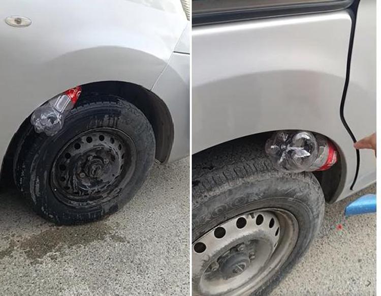 Truffa della bottiglietta nella ruota - (Fermo immagine)
